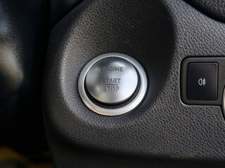 A silver button with the word engine on it