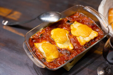 Large piece of fillet of white sea fish, cod with xanfaina sauce, baked with vegetables