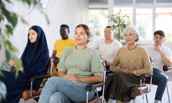 Portrait of students of different years and of different nationalities on training session in lecture hall