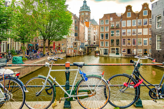 Amsterdam, Netherlands. two canals merging to form a corner for historical buildings.
