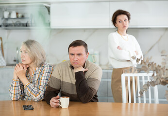 Family quarrel, all family members are upset, disappointed, keeping silent