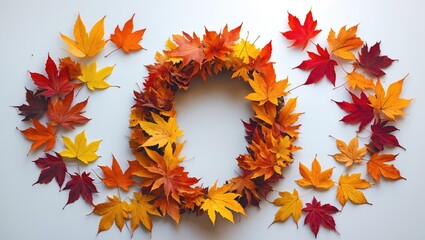 Brightly colored fall leaves on a white surface.