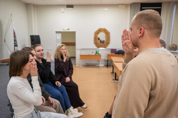 Hearing impaired students communicate during breaks at the university. 