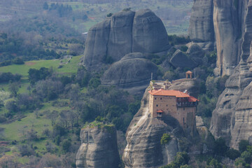 Detail view of landscape of the famous rock formations of Meteora with Agios Nikolaos Monastery on top of the rocks, Kalambaka, Thessaly, Greece