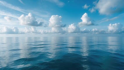 Gorgeous azure sky featuring fluffy clouds over the serene sea.