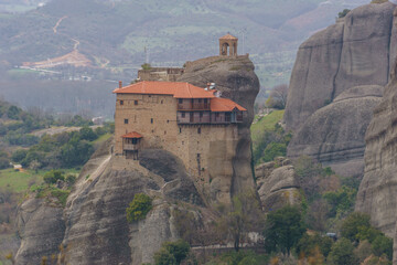 Detail view of landscape of the famous rock formations of Meteora with Agios Nikolaos Monastery on top of the rocks, Kalambaka, Thessaly, Greece