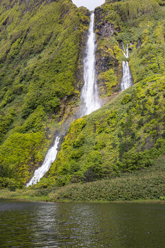 Azores, Portugal. Waterfall dropping into Lagoa dos Patos on Flores Island.