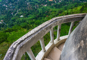 Narrow staircase and stone railing of the Ambuluwawa tower, Gampola, Sri Lanka