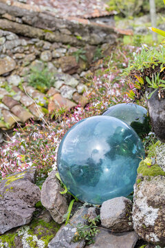 Aldeia da Cuada, Azores, Portugal. Glass fishing net floats in a garden on Flores Island.