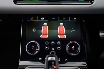 Close-Up of Heated Seat Button in Car Interior