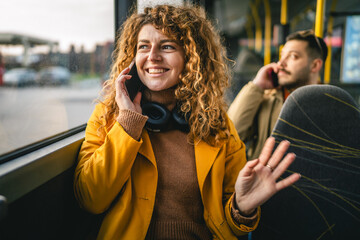 Naklejka premium woman public transport passenger talk on mobile phone during ride