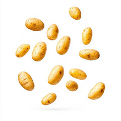Obraz premium Fresh potatoes tumble against a clean white backdrop, showcasing their earthy color and rough texture beautifully.