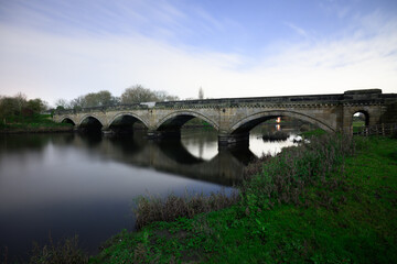 Fototapeta premium Willington Bridge Crossing the River Trent in Derbyshire