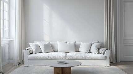 Light-filled, minimal living space with white sofa, curtains, and round coffee table