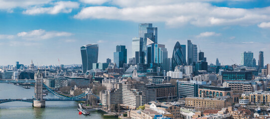 Aerial view of London featuring Tower Bridge over the River Thames, The Gherkin, The Walkie Talkie,...