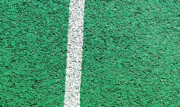 Green rubber road background texture. Bicycle path vector illustration. Green rubber flooring and white line, textured grainy surface background, outdoor sports ground floor. Top view, copy space.