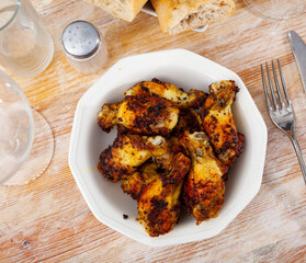 Plate with hot spicy homemade baked chicken wings