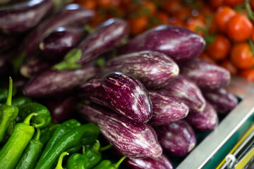Fresh eggplants laid out nicely for sale in market