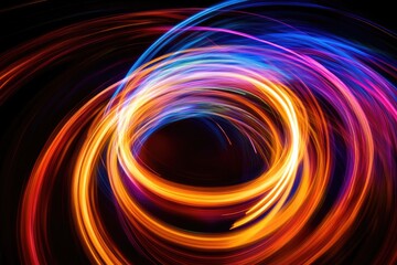Abstract swirling light trails create vibrant, colorful, dynamic artwork.