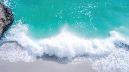 Fototapeta premium Serene ocean wave crashing on sandy shore peaceful coastal scene turquoise water white foam