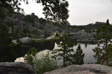 Fototapeta premium Rock Formation Surrounding a Serene Lake in South Dakota