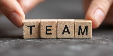 Building a strong team identity with wooden blocks during a collaborative work session at a modern office