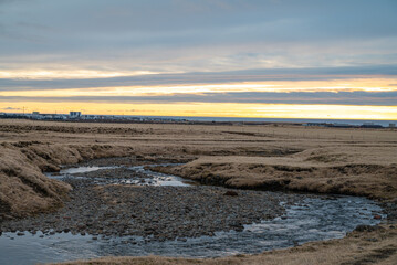 sunset above town of Akranes in Iceland