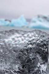 close-up of glacier ice with blue glaciers in the background, Iceland, travel