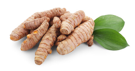 Raw turmeric roots and green leaves isolated on white