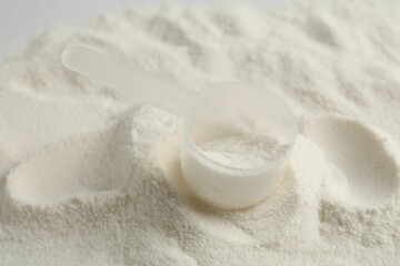 Collagen powder and scoop as background, closeup