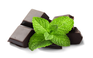 Dark chocolate pieces and mint leaves on white background