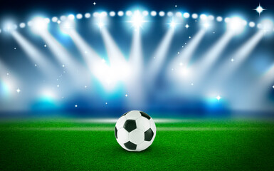 Soccer ball on green grass at stadium. Football game