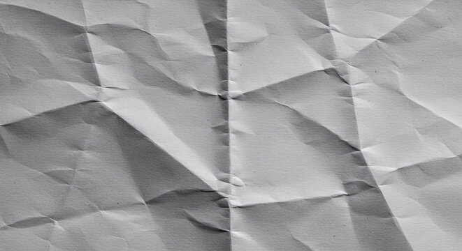 Abstract Crumpled Texture: A close-up shot of a wrinkled paper surface, with its intricate folds and shadows creating a dynamic abstract pattern, perfect for minimalist design and backgrounds.
