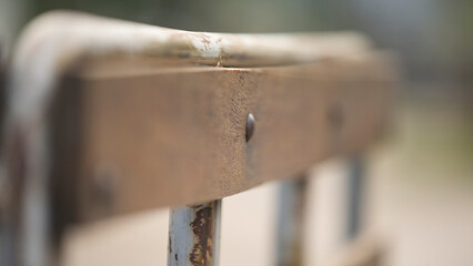 Close-up of a rusty iron fence. Selective focus.