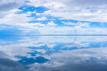 Salar de Uyuni, Bolivia. Clouds reflecting over the Salar de Uyuni, the world's largest salt flat.