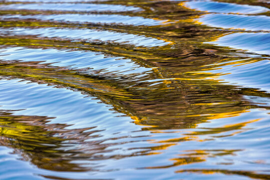 Water reflections behind small boat in the Pantanal region, Mato Grosso, Brazil, South America