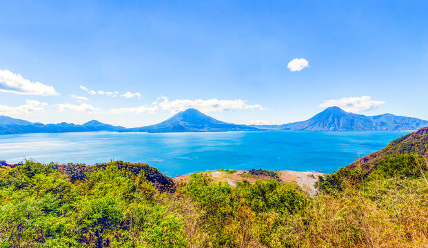 Guatemala. Lake Atitlan, with Volcan Atitlan, Toliman and San Pedro with Volcan Fuego on the left.
