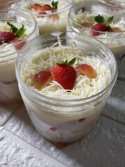 Refreshing fruit salads and rich tiramisu served in clear jars
