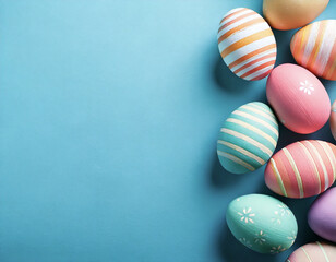 Easter eggs painted with stripes and polka dots in pastel colors on a light blue background.