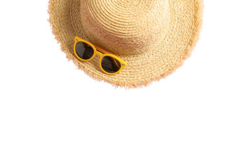 Bright straw hat sits alongside yellow sunglasses for sun protection, isolated on white, PNG
