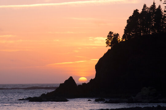 Oregon, Sunset Bay State Park. Sunset behind rocky point.