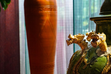 Close-up of Decorative Dragon on an Antique Ceramic Vase Indoors