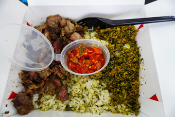 Delicious Rice Plate with Grilled Meat and Sambal Chili Topping