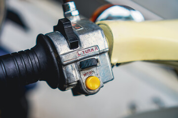 Examining Vintage Scooter Handlebar Controls with Turn Signal and Horn