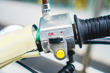 Motorcycle Handlebar Control Close-up with Throttle, Switch and Button