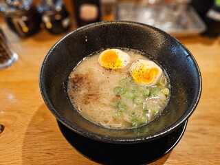 egg ramen with vegetable soup in a pan