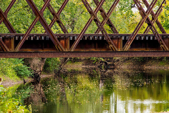 USA, Vermont. Rusted train bridge with tracks over Otter Creek