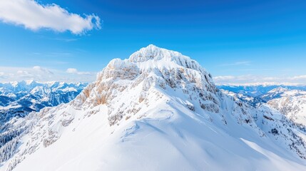 Majestic snowcapped mountain peak under vibrant blue sky stunning high angle view of winter landscape