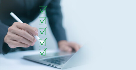 Businessman checklist concept as clipboard document checklist form on the virtual screen Use your...