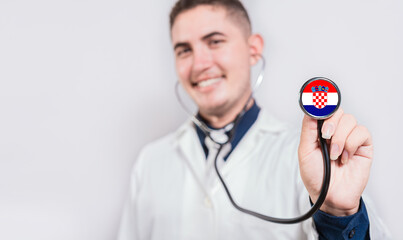 Doctor showing stethoscope with Croatian flag. Croatia national healthcare concept